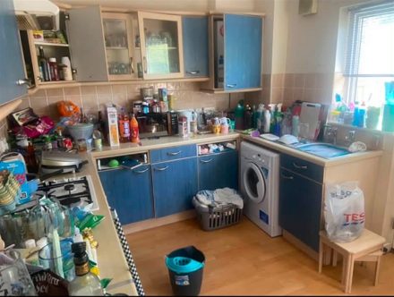 Dated blue kitchen units before replacement in a Central Belt home