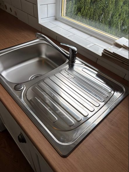 New sealed worktop with stainless sink, drainer and mixer tap fitted
