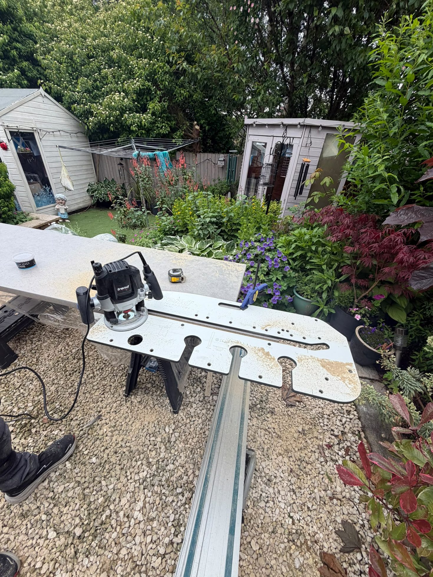 Router and guide rail set up on site to machine timber to a precise fit, shopfitting joinery by Impact Joinery