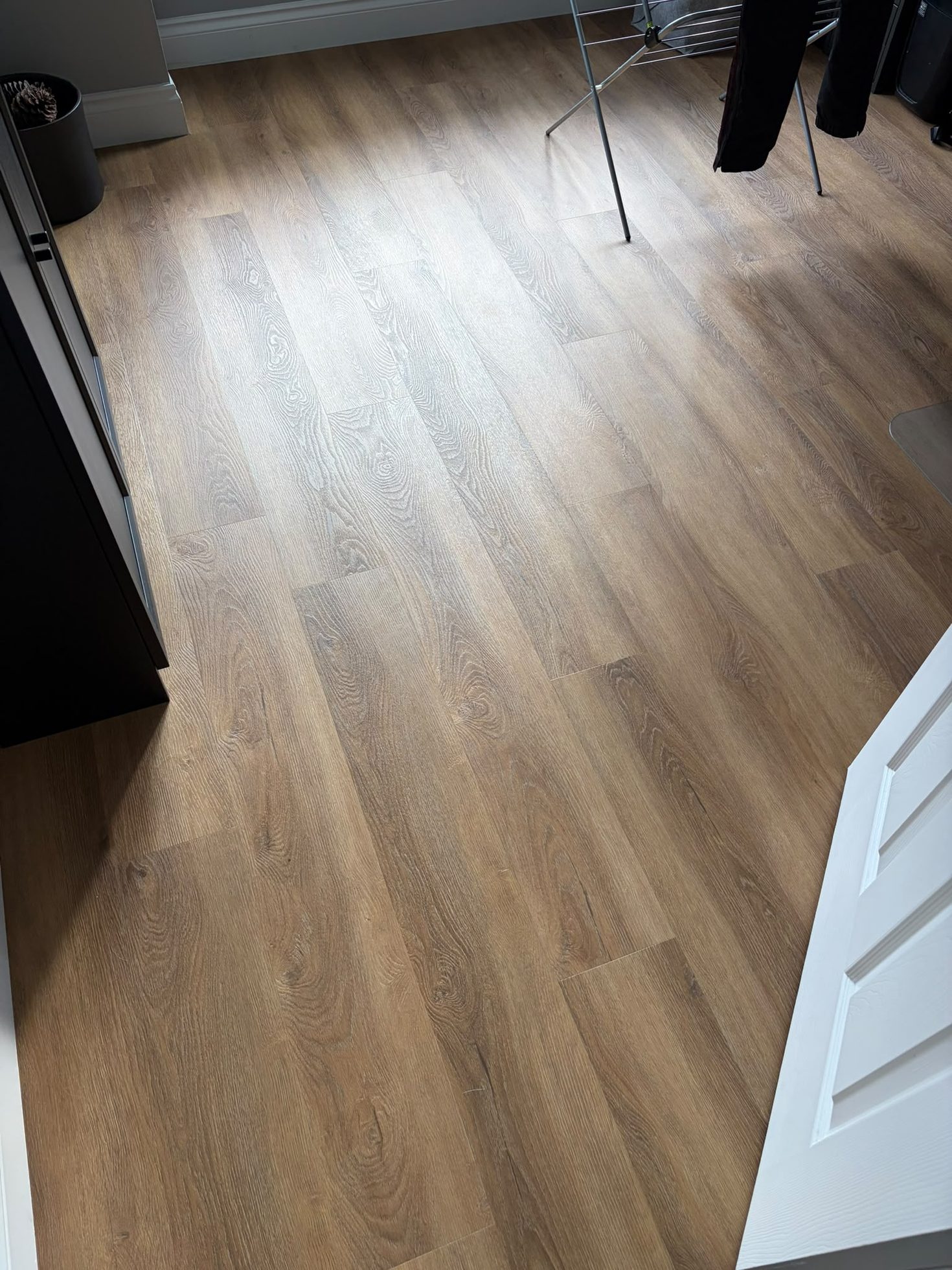 Finished light oak-effect plank flooring fitted with new skirting, joinery by Impact Joinery, Cumbernauld and Glasgow